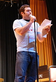 Author photo. This photo is of Brian Jaeger reading at the annual Thassophobia Read-In he organized at Menomonee Falls High School near Milwaukee, Wisconsin.
